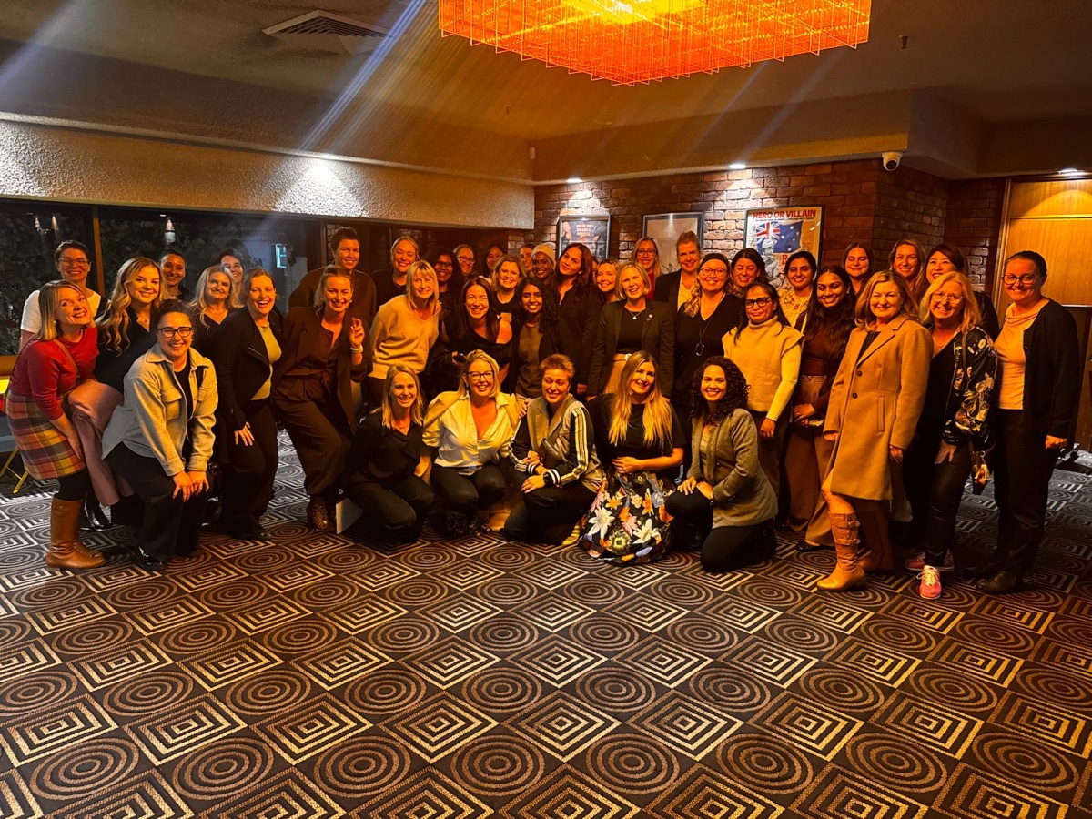 WITH community gathered at an event